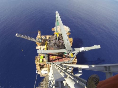 An image of the Angel platform from the top of the flare boom as part of a V-LIFT Flare Tip replacement bia rope access, custom designed frames and strolley mechanisms.