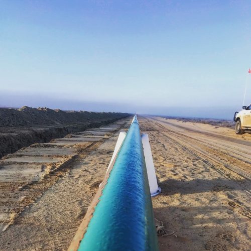 A pipeline extending off into the horizon.