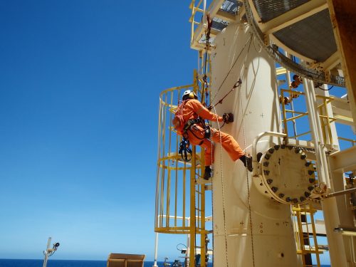 A vertech IRATA rope access technician is carrying out NDT on a support beam onboard an FPSO.