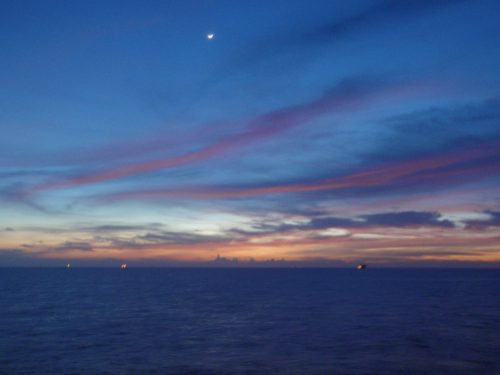 the horizon at sunset as seen from the fpso.