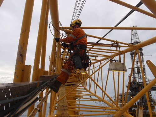 a vertech IRATA rope access technician working on the inside of a crane arm.loading=