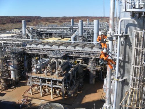 Two Vertech IRATA Rope Access Technicians scale the side of the Gladstone LNG plant.