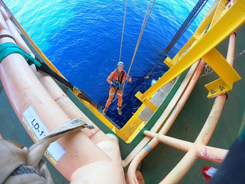 A Vertech IRATA Rope Access Technician hangs down the side of the CPF.