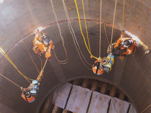 A team of IRATA Rope Access Welders conducting Weld repairs on an LNG facility