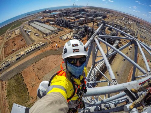 A IRATA rope access technician at the top of the Wheatstone LNG plant Flare during the Greenfield construction phase