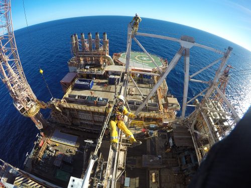 Two Vertech IRATA Rope Access Technicians perform duties as part of a derrick decommissioning service.