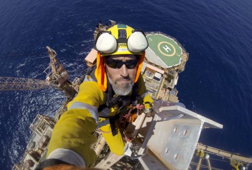 A multi skilled IRATA level 3 rope access supervisor at the top of a derrick structure as part of the goodwyn alpha derrick Decommissioning project