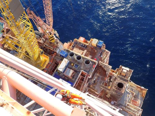 A vertech IRATA rope access technician hangs off the side of the Goodwyn alpha platform as part of a non-destructive testing service.