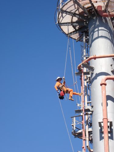 A Vertech IRATA rope access multi-disciplined inspector is inspecting the Karratha gas plant.