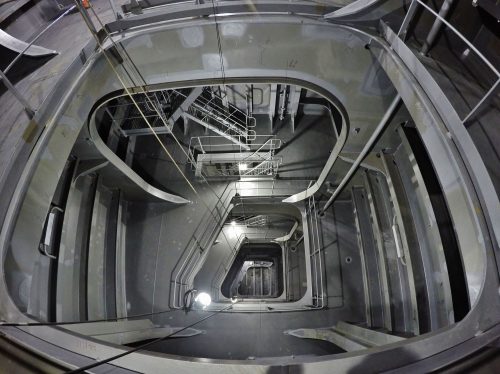 The inside of the FPSO showing stairs going down several levels.