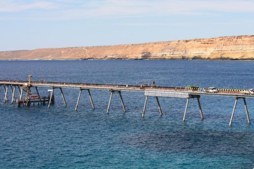 A long shot of a bridge over water.