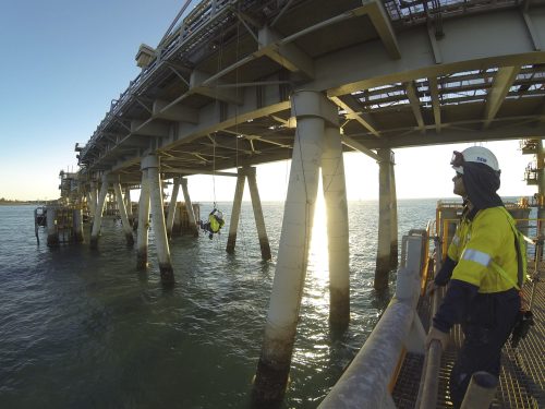 A vertech IRATA rope access team conducting rope access coating remediation, repairs, NACE inspection and other fabric maintenance works on a jetty