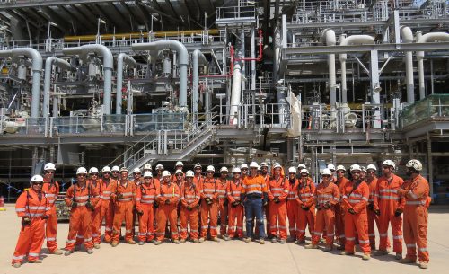 The vertech team poses a photo in front of the INPEX LNG plant.