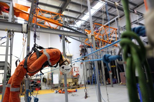 A standoff image of our IRATA accredited rope access facility and a rescue dummy in suspension at Osborne park, western Australia