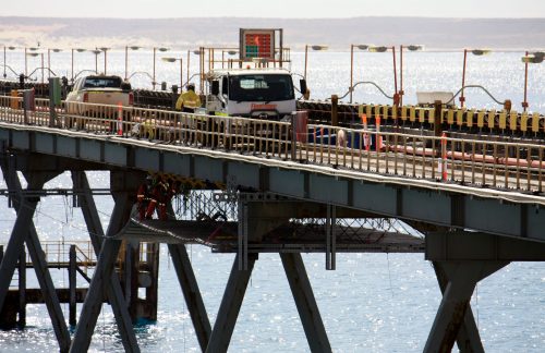 An image taken of a Vertech Engineered decking system installed under the dampier salt coastal infrastructure as part of a specialist access, coating remediation and repair campaign.