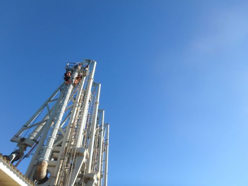 Two vertech IRATA rope access technicians scale the structure of the KGP Facility.