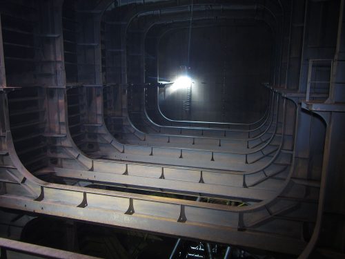 An image from the inside of the hull with a light illuminating the far side.loading=
