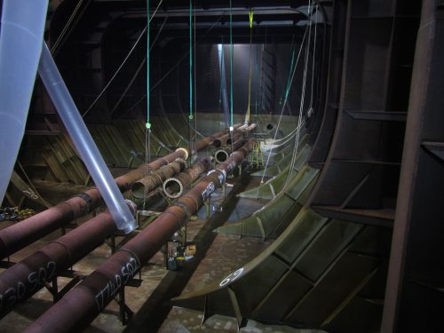 Many pipes on display inside the hull.
