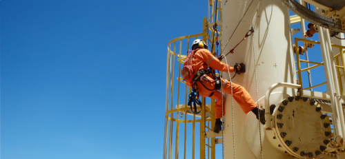 A rope access, AICIP and multi disciplined NDT inspector conducting specialised NDT, corrosion mapping on an offshore pressure vessel.