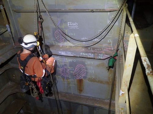 A Vertech rope access marine inspector takes NDT and ultrasonic thickness readings on an FPSO hull.