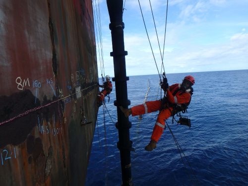 A Vertech rope access marine inspector takes NDT and ultrasonic thickness readings on an FPSO hull.