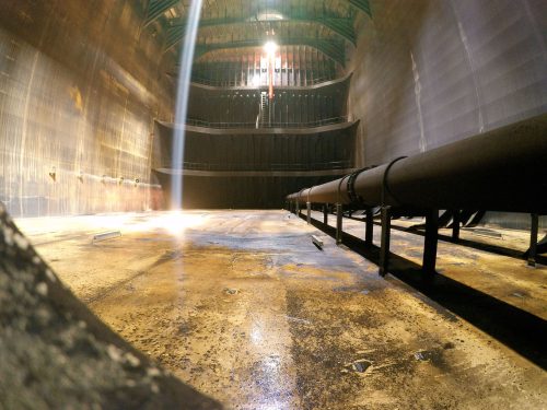 A view of a pipeline running across the floor of the hull of the Nganhurra FPSO.