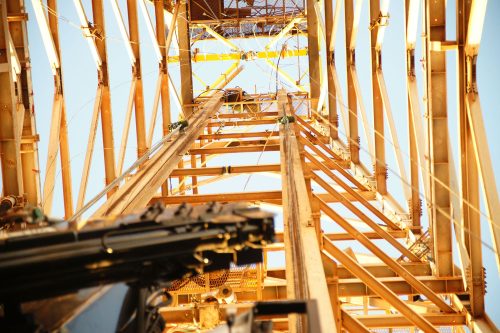 A bottom-up view of a derrick.