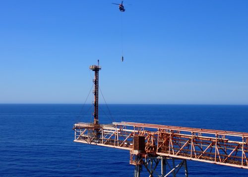 A helicopter approaching the NRA Flare boom to install the new Flare tip as part of a V-FLARE package for woodside energy A helicopter approaching the NRA Flare boom to install the new Flare tip as part of a V-FLARE package for woodside energy