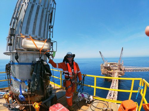 A vertech technician poses for a photo onboard the North Rankin C.