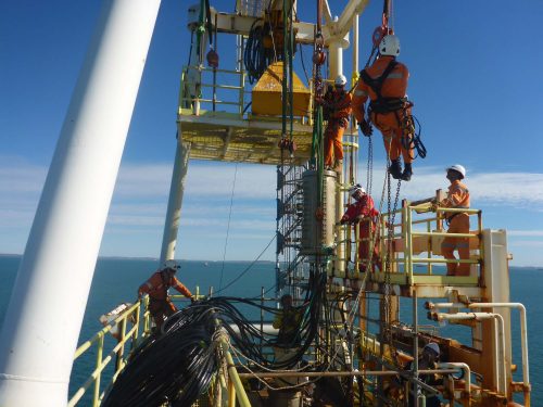 IRATA Rope access tradesmen decommissioning a derrick on a offshore production platform.