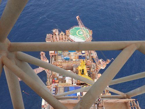 The view of the main FPSO platform from atop the flare tip derrick.