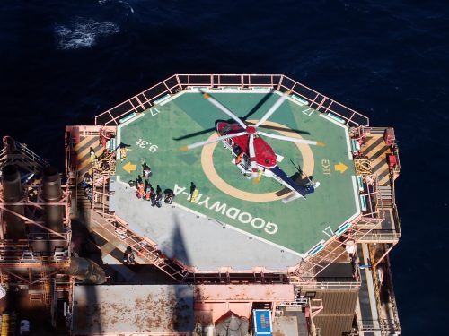 The view of the helicopter landing pad from atop the flare tip derrick.