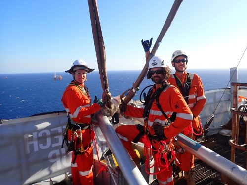 Vertech technicians pose for a photo on top of the ichthys venturer FPSO derrick,