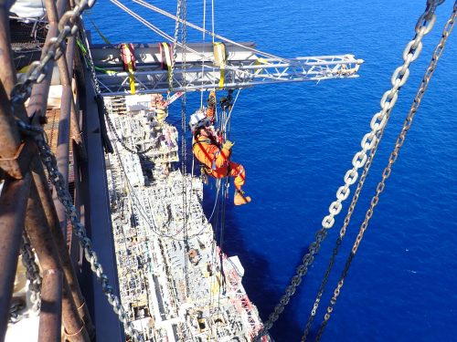 A Vertech IRATA level 3 mechanical fitter setting up the rigging system above the Ichthys Venturer FPSO for Inpex as part of a flare tip replacement.