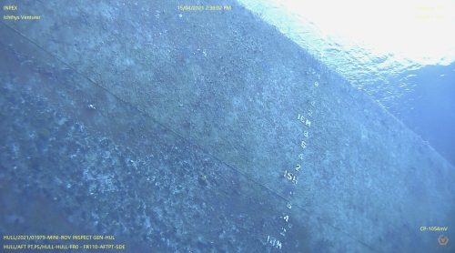 This is an underwater photograph from a ROV inspection showing the side of the "INPEX Ichthys Venturer". The hull is covered with marine growth and biofouling. A clear view of marked measurement points ascending vertically on the hull provides a reference for inspection—the water's ambient light shifts from dark blue at the top to light blue at the bottom. The image includes details such as date, time, vessel heading of 3.0 degrees, and a depth of 5.1 meters, with Geo Ocean's logo in the corner.