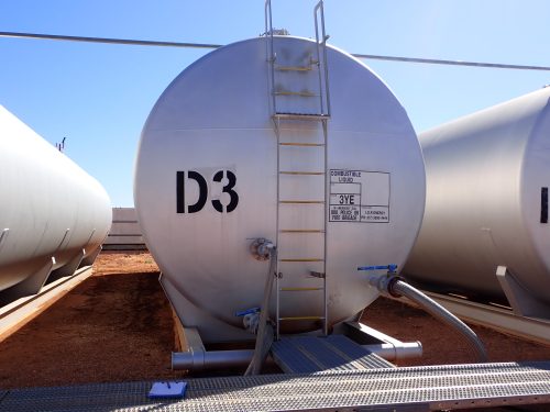 A ladder on the front-facing side of a fuel tank allows access for technicians to climb on top.