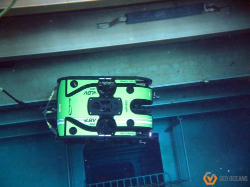 An ROV is floating in the water as part of an inspection procedure.