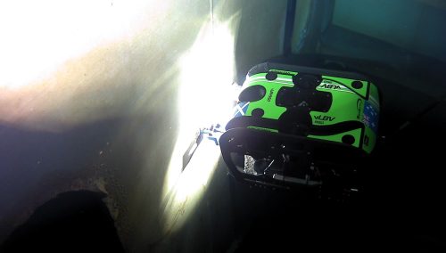 An ROV is inspecting a tank wall.