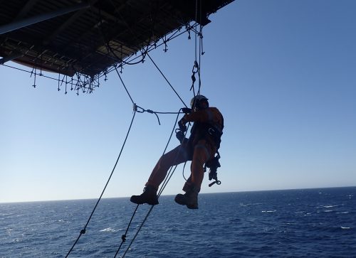 A Vertech IRATA rope access technician conducting helideck inspections and Non-destructive testing offshore