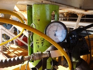 A close up of a pressure gauge used in testing.