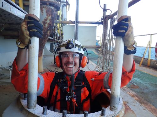 A vertech technician is all smiles as they emerge from a confined access point on the ningaloo vision fpso.loading=