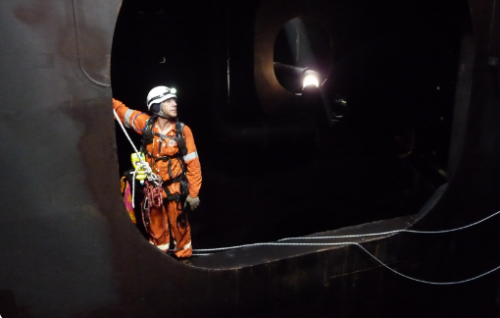 An IRATA NDT and marine class inspector conducting a special periodic survey (SPS) on an offshore drilling rig.