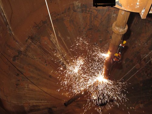 Vertech IRATA rope access mechanical and IRATA rope access welders conducting remediation and repairs at height on mining infrastructure in the Pilbara