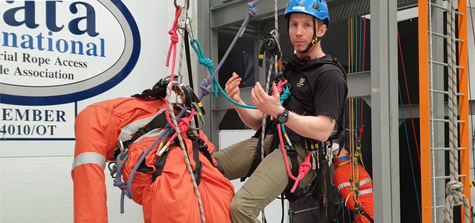 IRATA certified instructor demonstrating advanced rope rescue techniques during a training session in Perth, showcasing safe use of harnesses, ropes, and ascenders in a controlled environment.