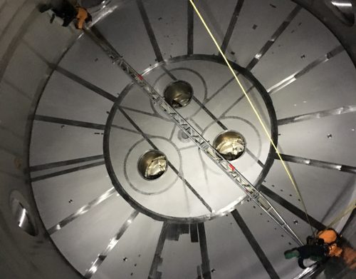 Rope access technicians conducting internal visual inspections of a silo using the Telescopic Truss boom to ensure 100% coverage of all areas.