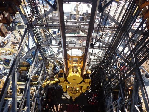 An image from the derrick structure of the to drive system and drilling facility below.