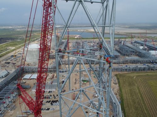 A vertech IRATA rope access technician climbs a derrick using ropes as part of an inspection service.