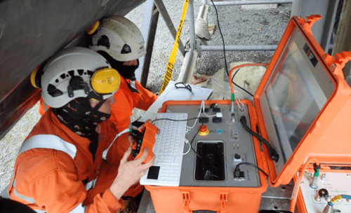 A Remote digital visual inspection (RDVI) team inspecting a pressure vessel with a robotic crawler.