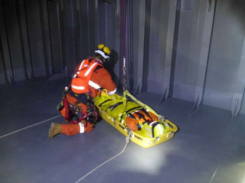 Vertech Marine class, Rope access inspectors completing a confined space rescue from a tank via a stretcher and haul system.