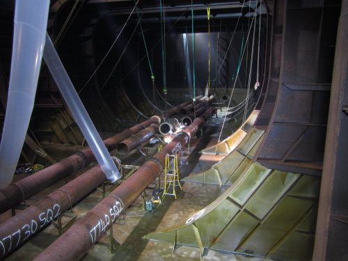 An image of the Marine piping within a FPSO's tanks being replaced and repaired by vertech rope access tradesmen